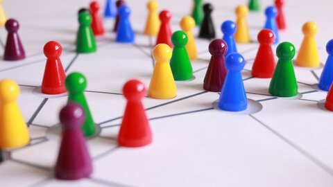 Colorful game pieces on a white playing field
