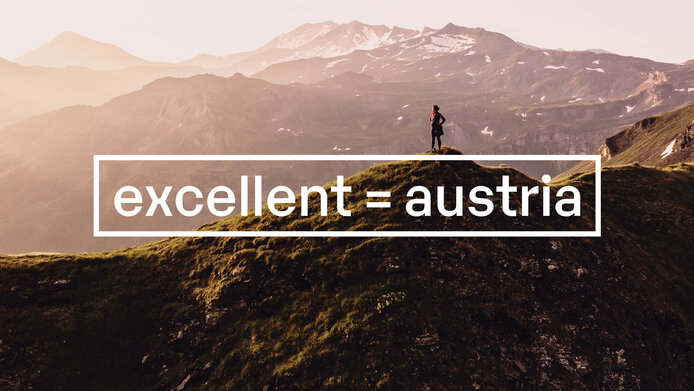 “excellent austria” logo with Austrian mountains in the background